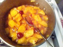 peach cobbler in saucepan