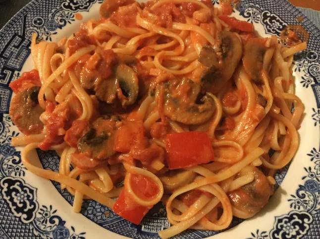 pasta plated with mushroom sauce